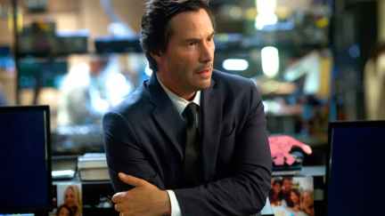 Keanu Reeves wearing a suit.