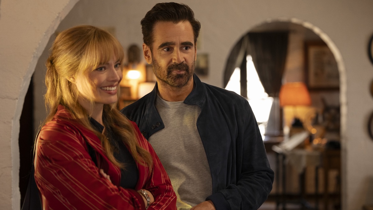 colin farrell standing next to margot robbie